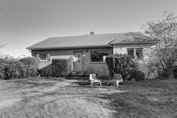 before-the-houses-exterior-with-neglected-overgrown-landscaping-left-much-to-be-desired.jpg