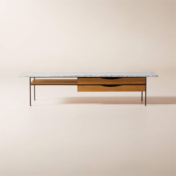 Designed in 1952, Paul McCobb’s C7806 coffee table from CB2 is hewn from American white oak and Arabescato marble.