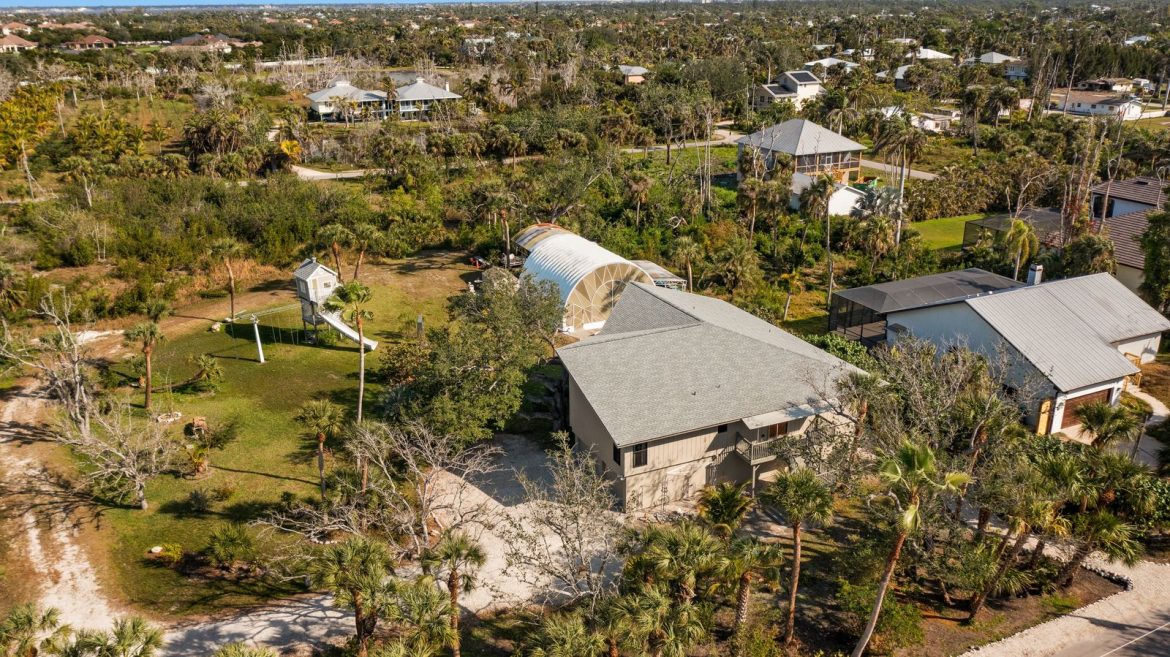 in-that-backyard-sits-a-treehouse-with-a-slide.jpg
