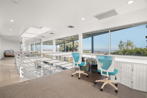 Off the second-floor guest bedroom is an office with a built-in desk.