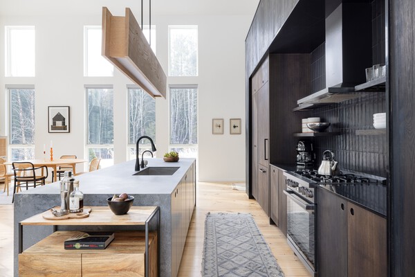 The kitchen cabinetry is fashioned from oak and the island is quartz.