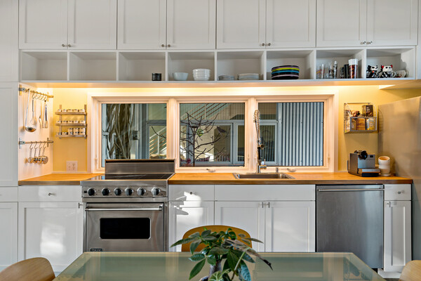 the-kitchen-looks-out-onto-a-small-courtyard-nestled-between-the-two-wings-of-the-home.jpg