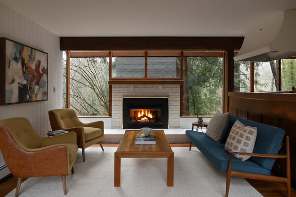The living room features a functional fireplace.