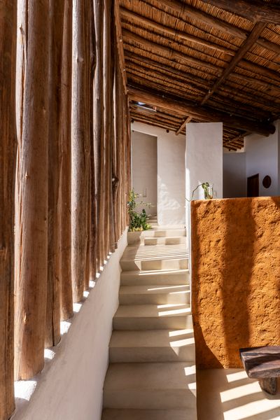 There is no glass in the entire house; wooden posts serve as ersatz windows.