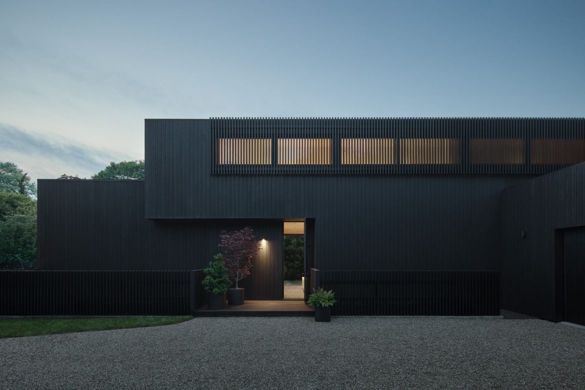 after-entering-through-a-gate-the-homes-charred-spruce-siding-presents-a-somber-face.jpg