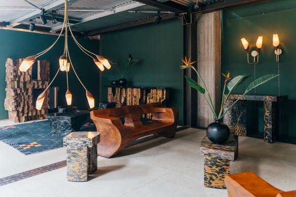 An emerald nook full of amber-hued pieces certainly caught my eye. Along with beautifully carved wood seating and storage units, marble stools and side tables created a pleasing mix of materials.