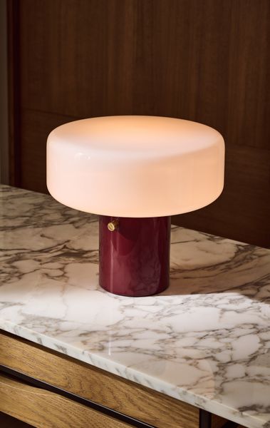 Bill Curry's Pill High Gloss Oxblood Red Iron table lamp captures the optimistic futurism of Space Age design. 