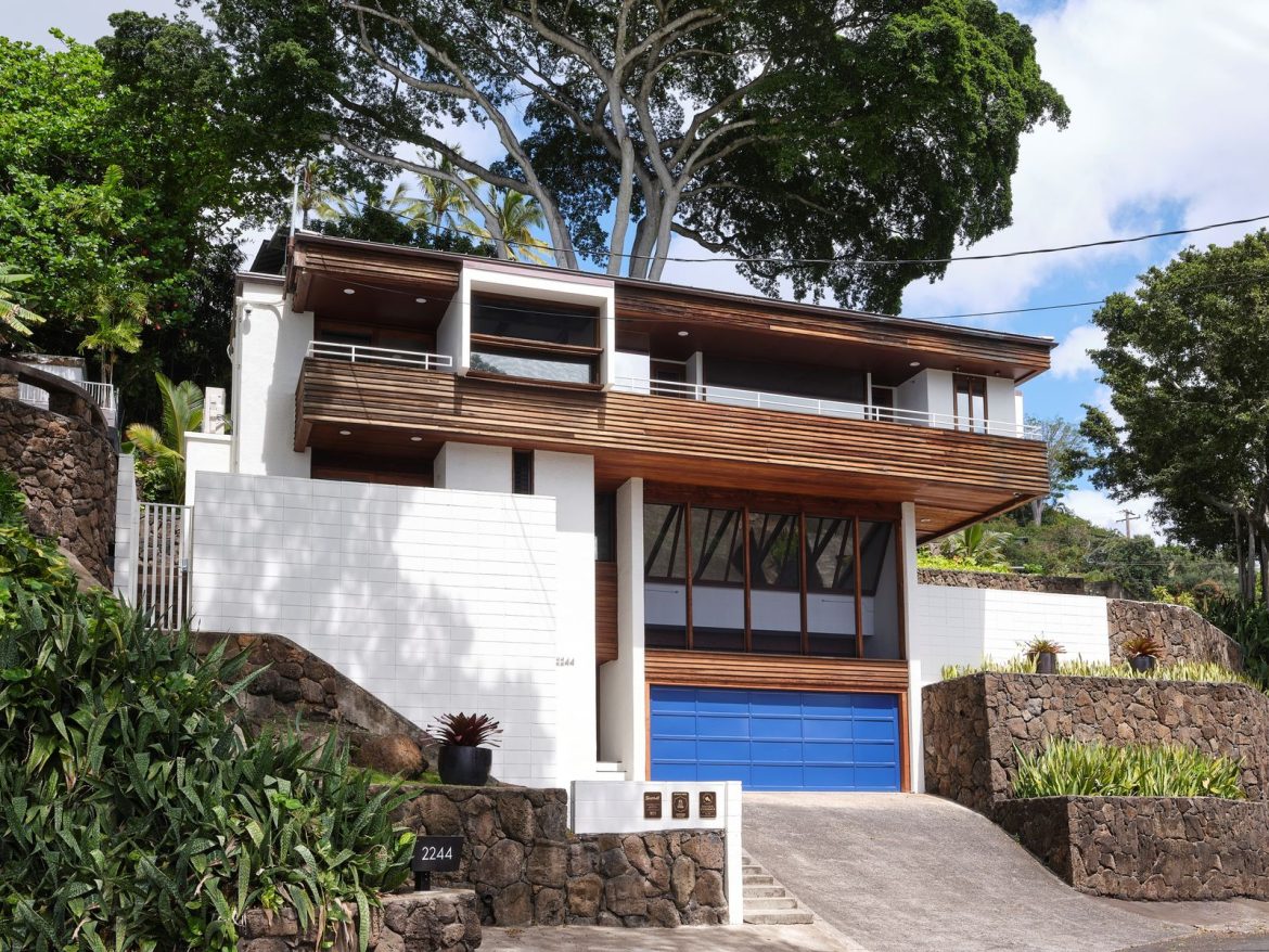 chip-detweilers-1974-residence-is-an-ode-to-tropical-brutalismand-its-been-meticulously-restored-down-to-the-original-deep-blue-shade-of-its-garage-door.jpg
