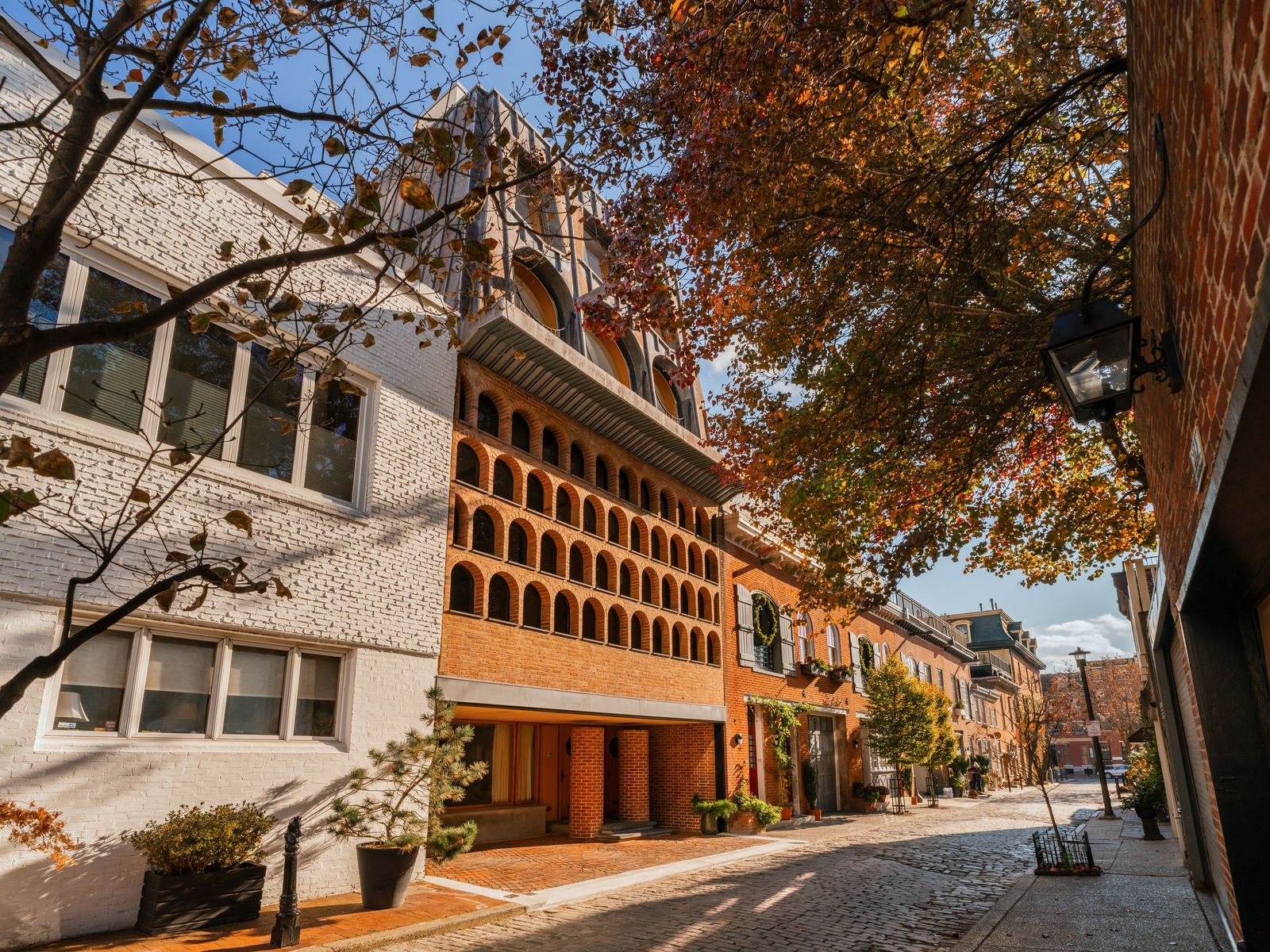 Over the course of 50 years, Frank Weise turned a carriage house into a residence and studio defined by intricate brickwork and a dramatic mansard roof.