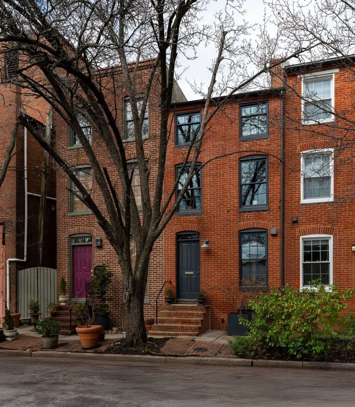 owner-and-architect-logan-mahaffey-refreshed-this-compact-three-story-homes-kitchen-bathrooms-and-wall-finishes-while-preserving-its-charming-staircase-and-brickwork.jpg