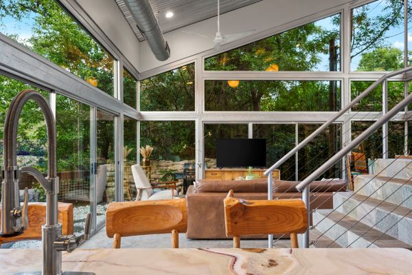 The home's glass walls reach heights of up to 30 feet.