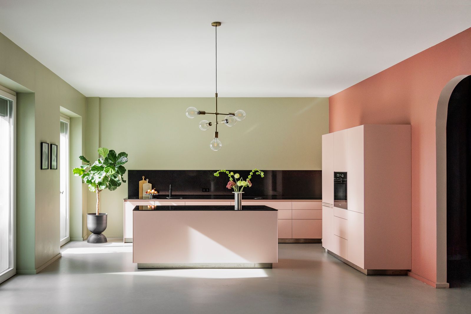 The pastel-hued kitchen comes with appliances from Miele and Bora.