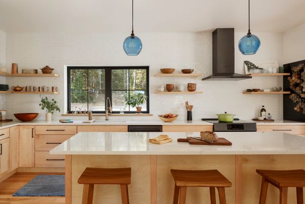 The pen shelving keeps the kitchen light and bright, which was the goal of its design. The kitchen and bath fixtures cost about $26,000.