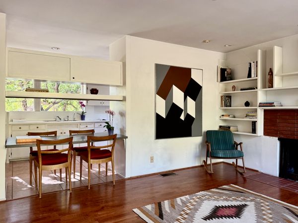 The windows, built-ins, and fireplaces are all original to the home, while the finishes are updated.