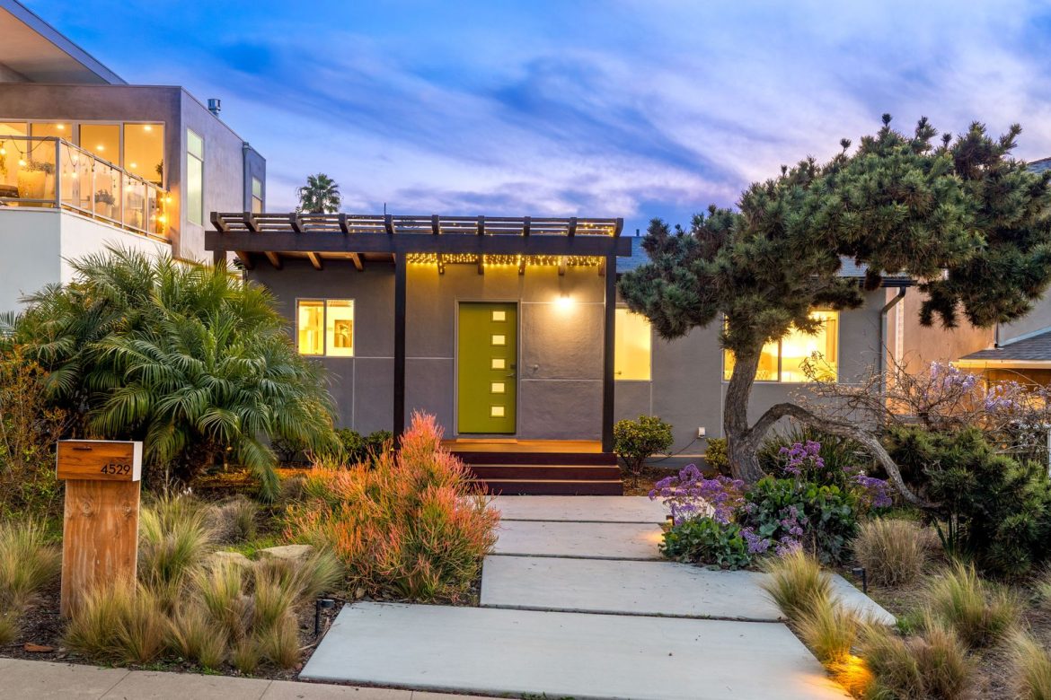 this-revamped-60s-beach-house-is-set-on-a-large-beautifully-landscaped-lotand-the-living-area-opens-to-a-big-balcony-with-sunset-views.jpg